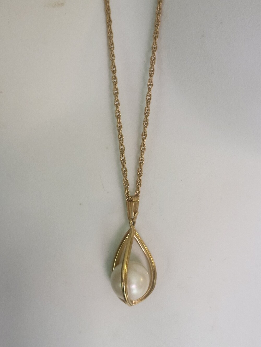 Avon "Tailored Elegance" Gold Tone Caged Faux Pearl Teardrop Pendant Necklace
